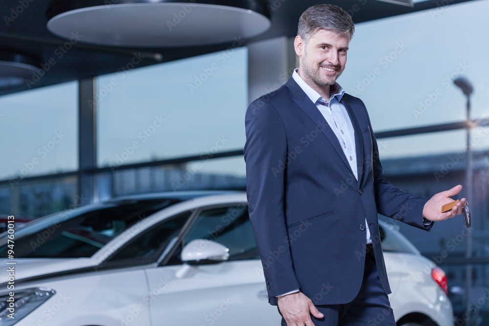 Smiling businessman buying car Smiling businessman buying car