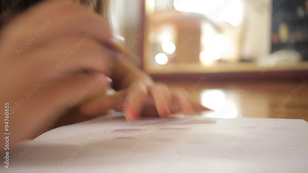 A girl lying on the floor and draw on a paper, then gets up and leaves. Now you only can see her legs. While leaving her reflection can be seen in the mirror which is out of focus. A girl lying on the floor and draw on a paper, then gets up and leaves. Now you only can see her legs. While leaving her reflection can be seen in the mirror which is out of focus.