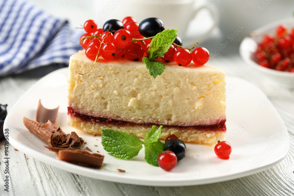 Delicious cheesecake with berries on table close up Delicious cheesecake with berries on table close up