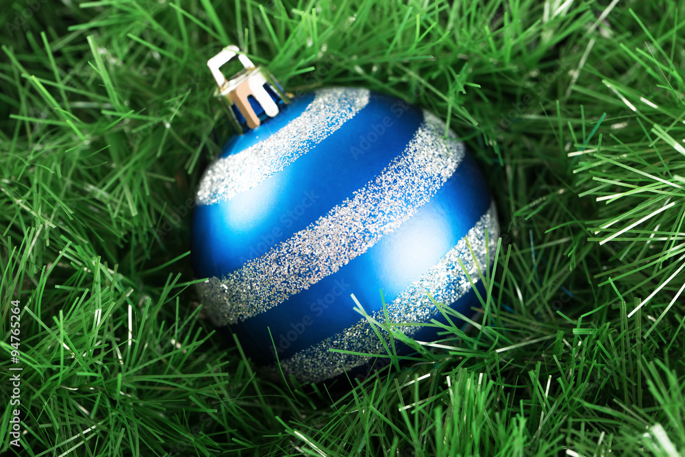 Fancy christmas ball with decoration isolated on grass Stock Photo