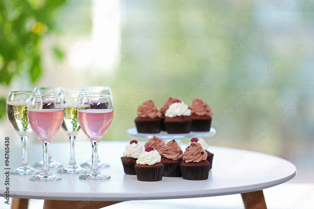 Tasting of wine and chocolate cupcakes, close up Tasting of wine and chocolate cupcakes, close up