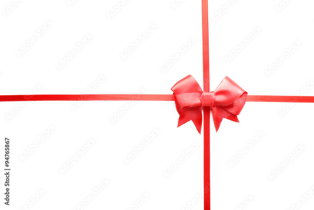 Shiny red ribbon with bow isolated on white Shiny red ribbon with bow isolated on white