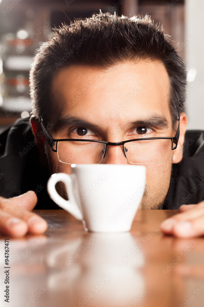 Expert sommelier meticulously analyzing the rich and velvety coffee cream swirling in an elegant espresso cup,ensuring an unforgettable sensory experience. Expert sommelier meticulously analyzing the rich and velvety coffee cream swirling in an elegant espresso cup,ensuring an unforgettable sensory experience.