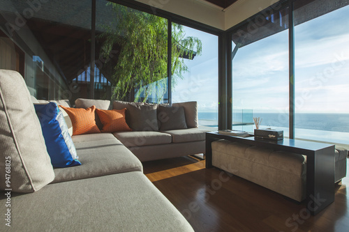 Luxury living room interior with shadow and seascape view