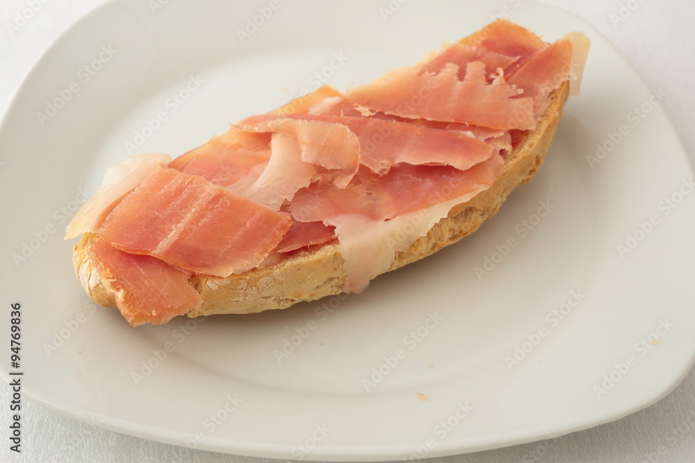 slice of bread with jamon serrano Spanish slice of bread with jamon serrano Spanish