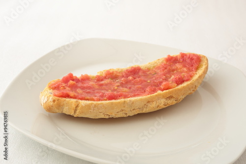 slice of bread with grated tomato
