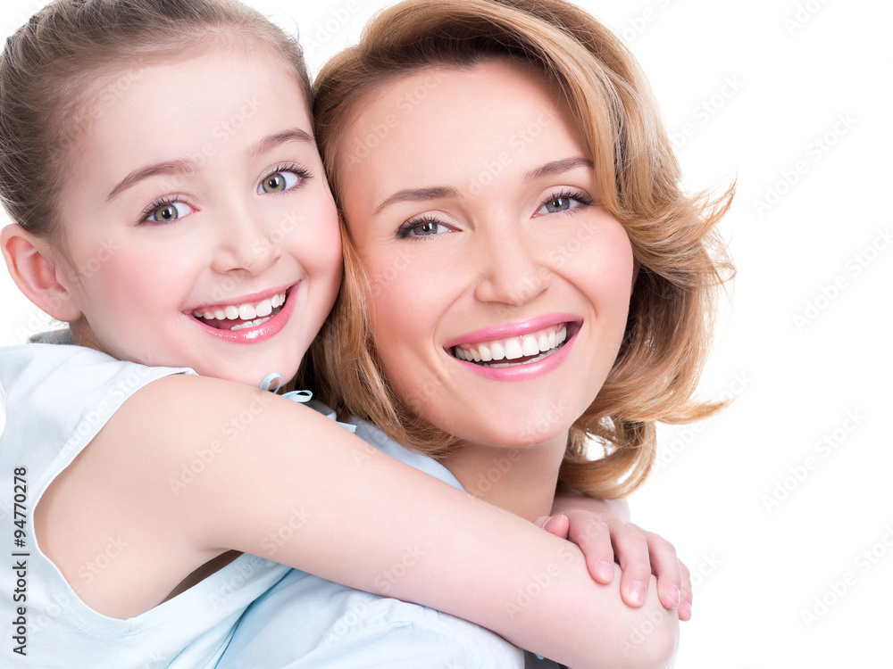 Closeup portrait of happy mother and young daughter Closeup portrait of happy mother and young daughter