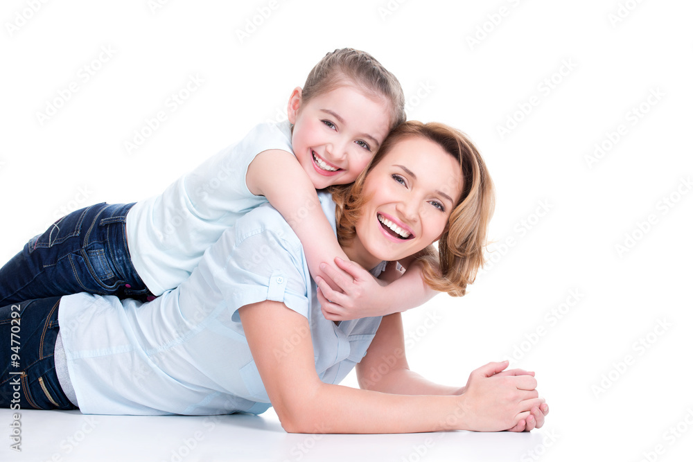 Portrait of smiling mother and young daughter Portrait of smiling mother and young daughter