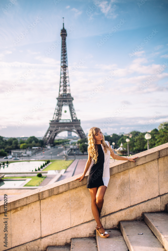 beautiful girl in Paris on a background of the Eiffel Tower