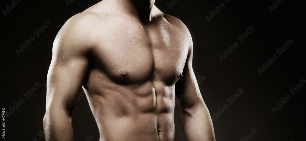 Strong, fit and sporty bodybuilder man over black background Strong, fit and sporty bodybuilder man over black background