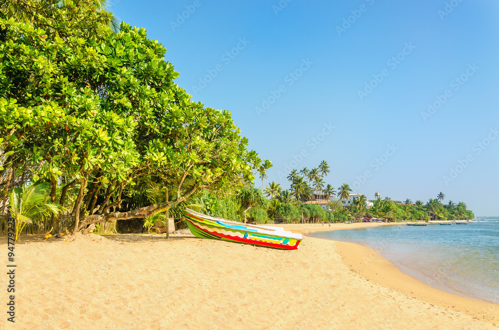 Wild and exotic Asian beach with colorful boat Wild and exotic Asian beach with colorful boat