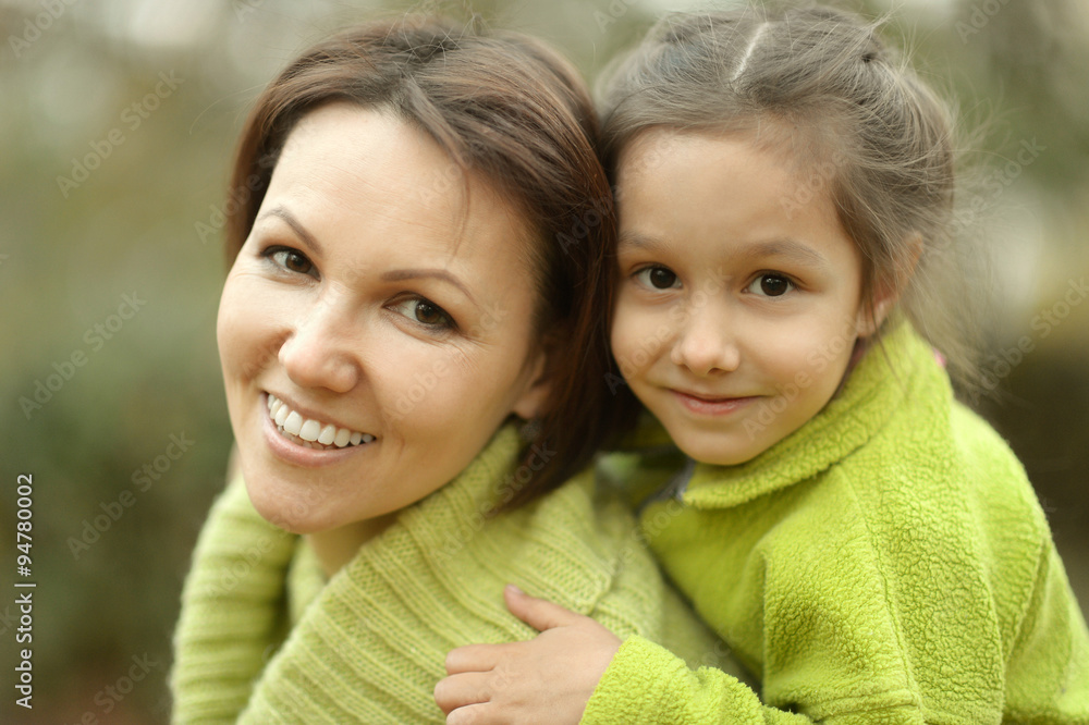 girl with mother in park girl with mother in park
