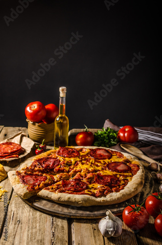 Rustic salami pizza with cheddar cheese and chorizo