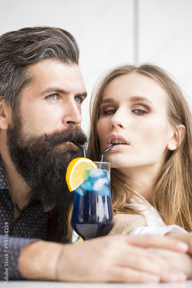 Young couple drinking cocktail Young couple drinking cocktail