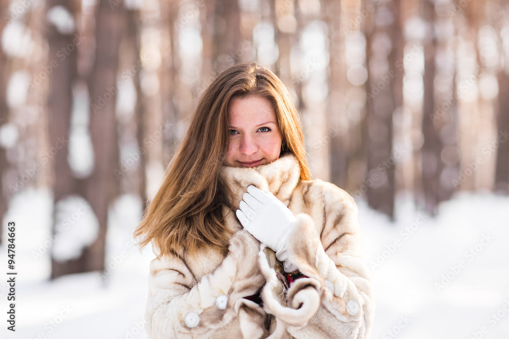 young woman in a winter park young woman in a winter park