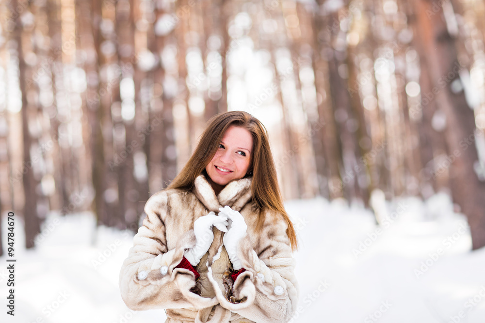 young woman in a winter park young woman in a winter park