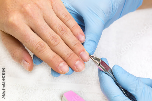 woman doing manicure beauty salon varnish wellness