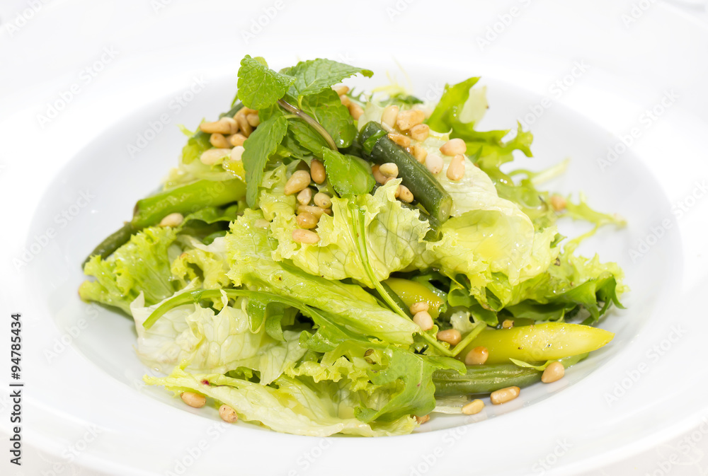 vegetable salad with asparagus on a table in a restaurant vegetable salad with asparagus on a table in a restaurant