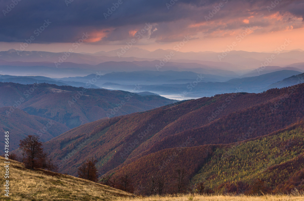Colorful sunset  in the autumn mountains.