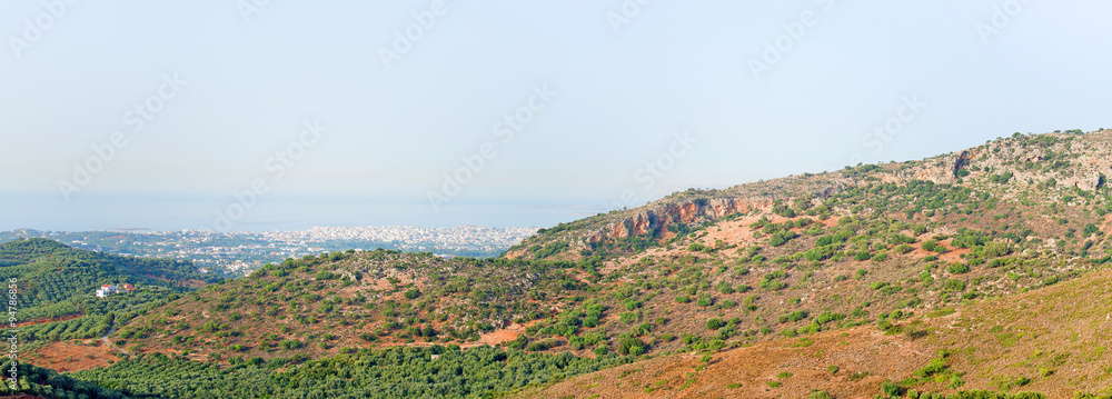 Mountains and valley with Chania city on Crete.