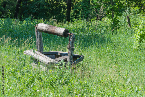 Abandoned wooden well photo