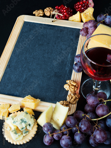 Chalkboard surrounded by different food photo