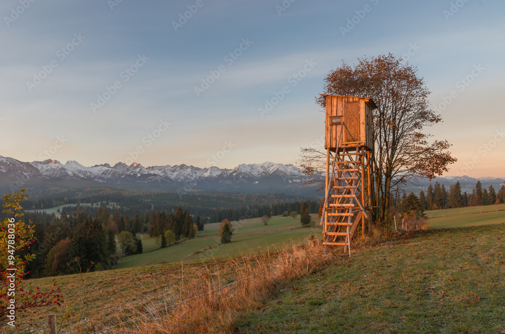 Hunting tower with Tatra mountains in the background early morning