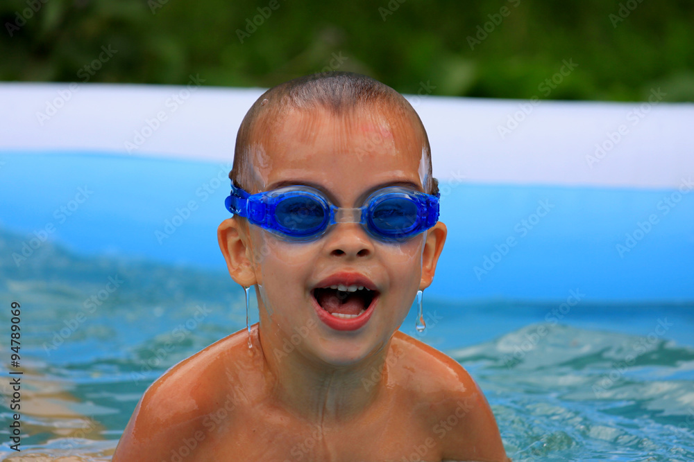 Boy in inflatable pool