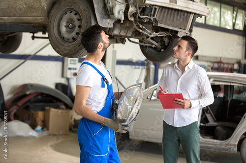 assessor and repair man talking