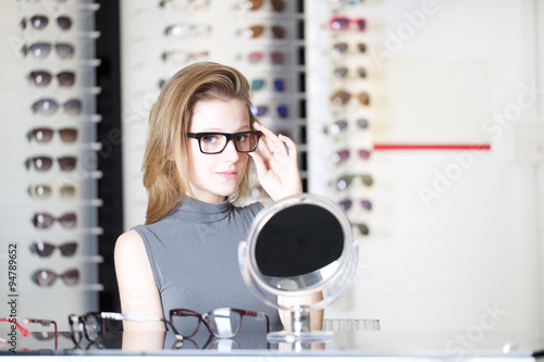 Young Woman Shopping For New Glasses
