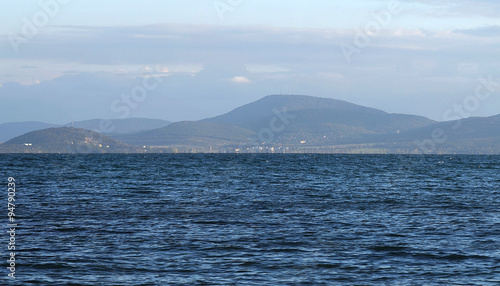 View of the sea and the hills on the opposite shore of the bay