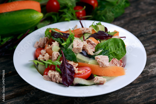 Tuna salad with Spinach, rocket, red ruby chard, tomatoes, cucumbers, carrot, red onion
