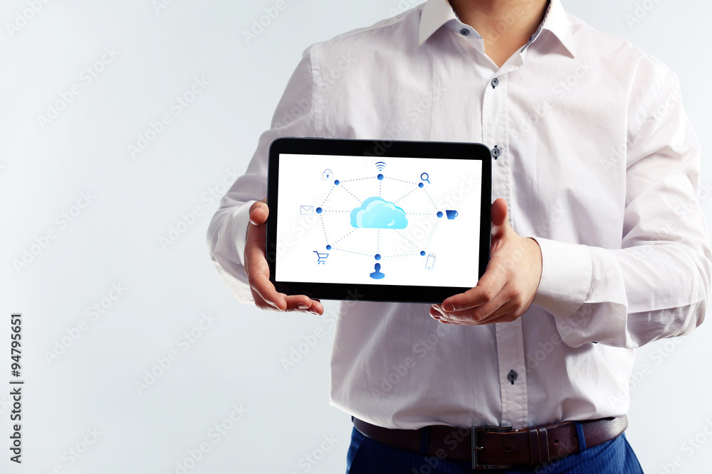 Businessman with cloud computing diagram on tablet-pc, modern technology concept Businessman with cloud computing diagram on tablet-pc, modern technology concept