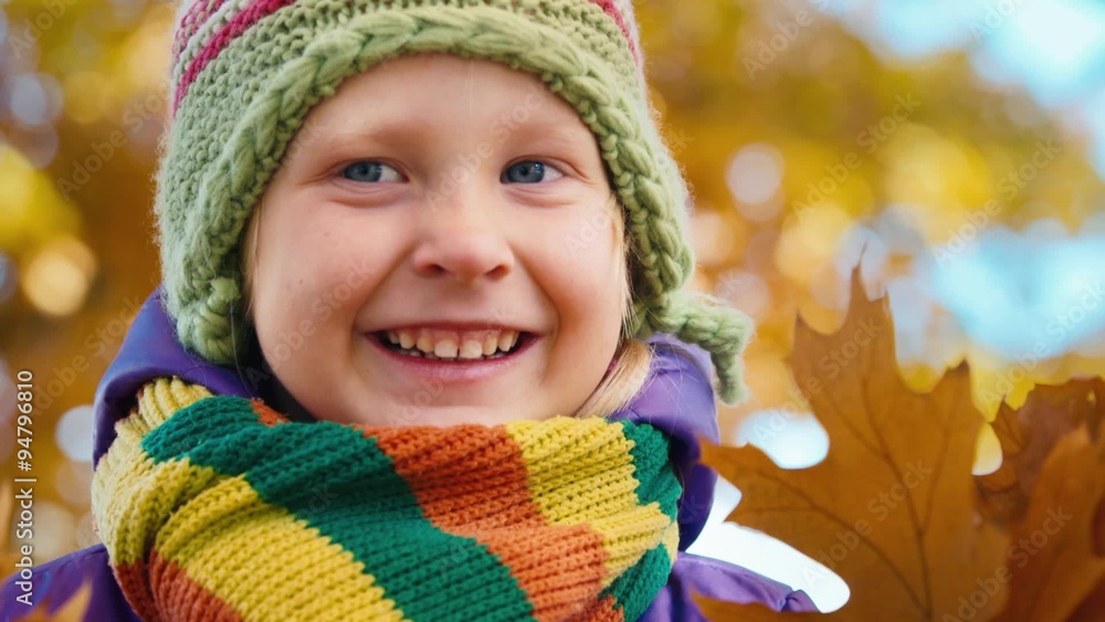 Little girl in the autumn park laughing and smiling Little girl in the autumn park laughing and smiling