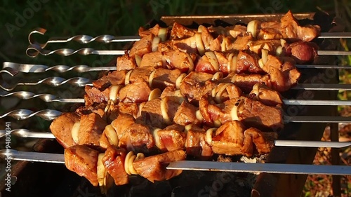 Barbecue with delicious grilled meat on grill.