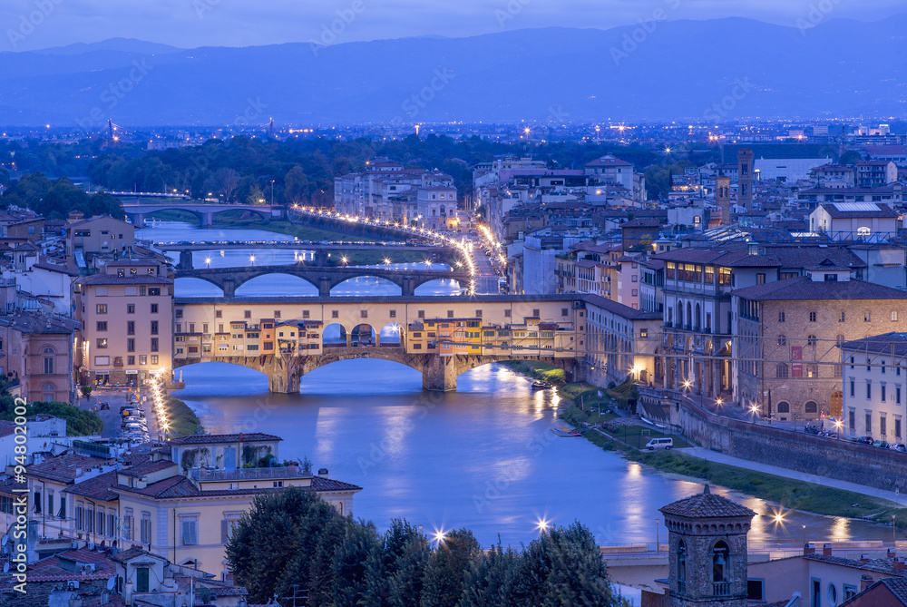 view to old bridge in twilight in Florence in Italy