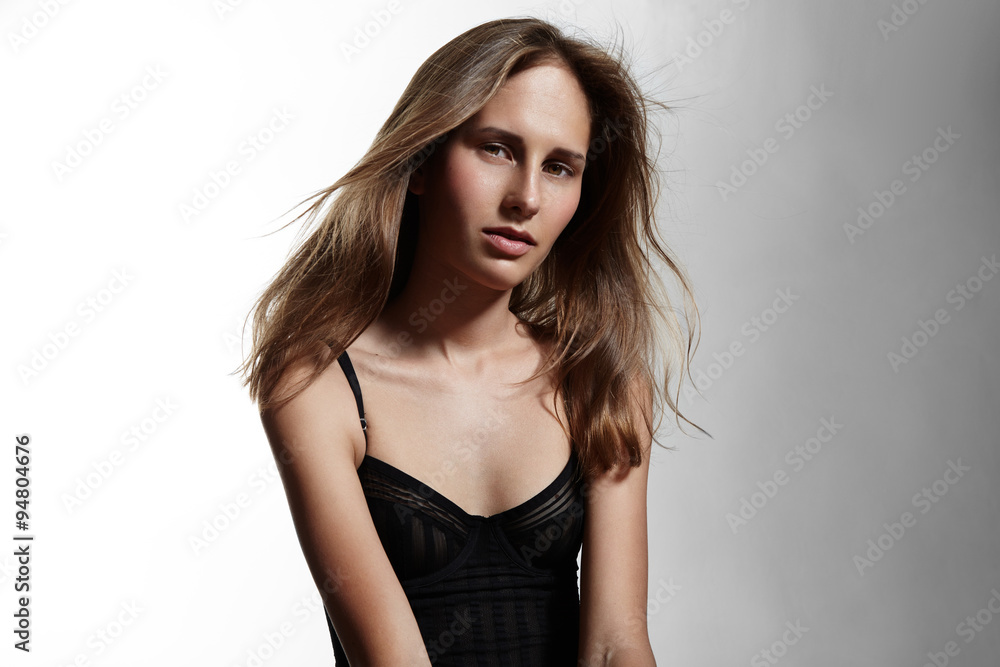 pretty young woman looking at camera pretty young woman looking at camera