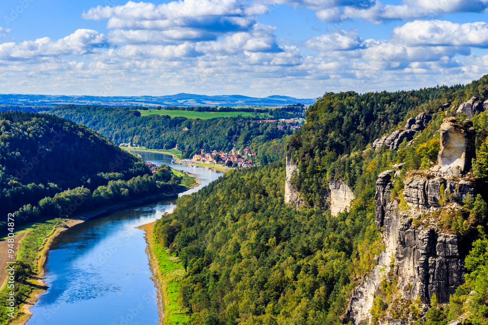 View from viewpoint of Bastei in Saxon Switzerland Germany to the town city and the river Elbe on a sunny day in autumn