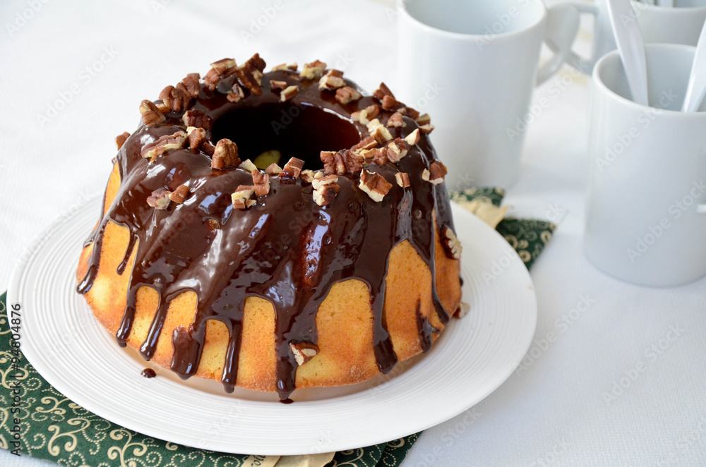 Bundt cake with chocolate glaze and pecan Bundt cake with chocolate glaze and pecan