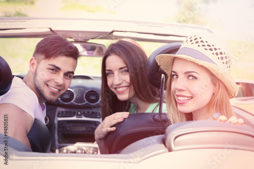 Three friends in cabriolet,...