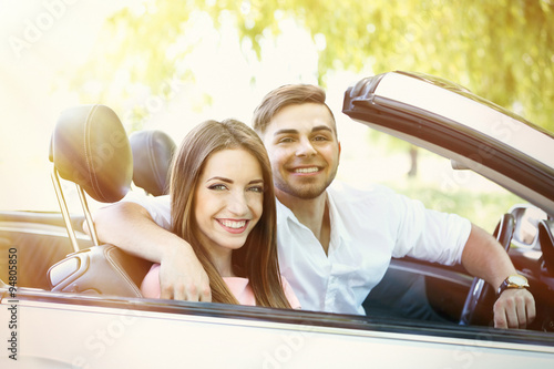 Young couple in cabriolet, ...
