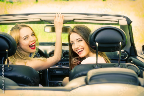 Two girls in cabriolet, out...