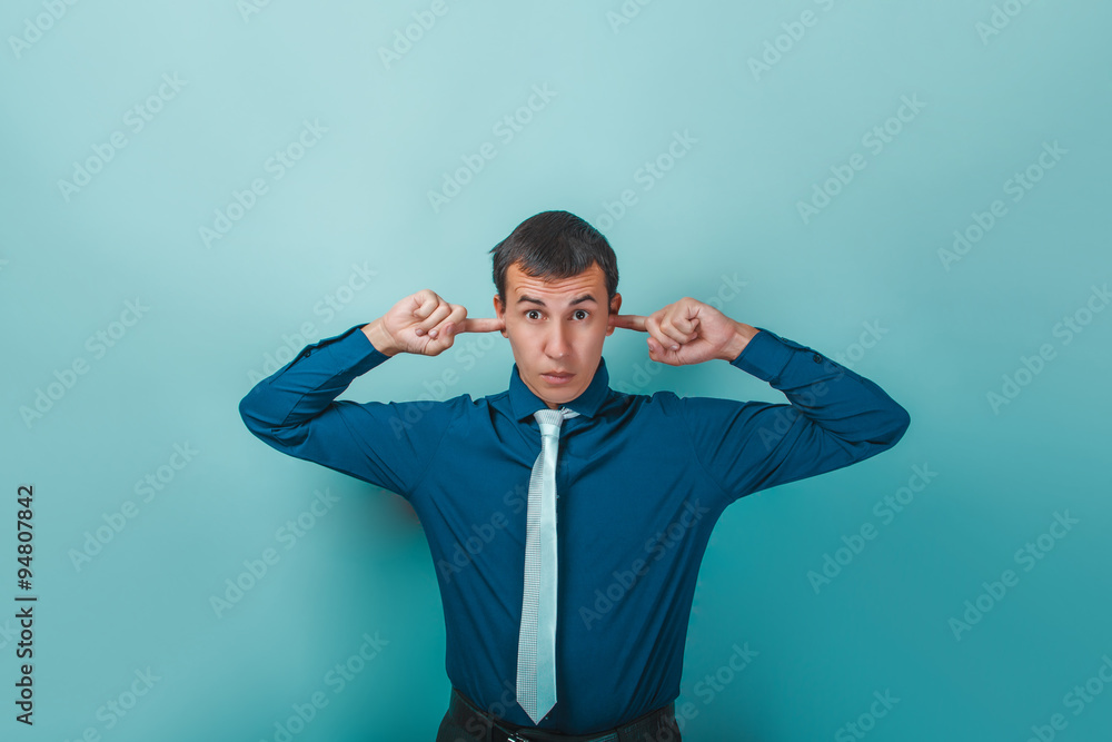 a man of European appearance thirty years covering his ears with a man of European appearance thirty years covering his ears with