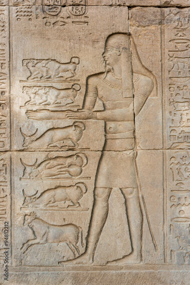 Egyptian hieroglyphics on the stone wall Egyptian hieroglyphics on the stone wall