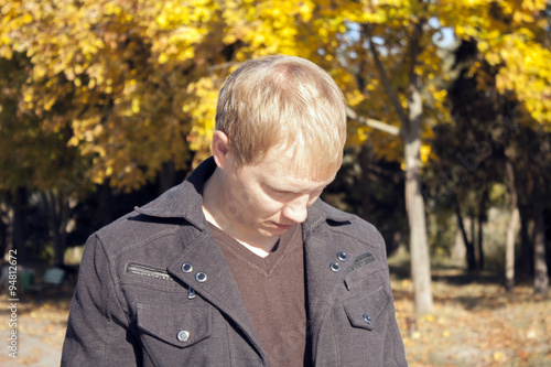 Portrait of a sad man in the park © KatrinA