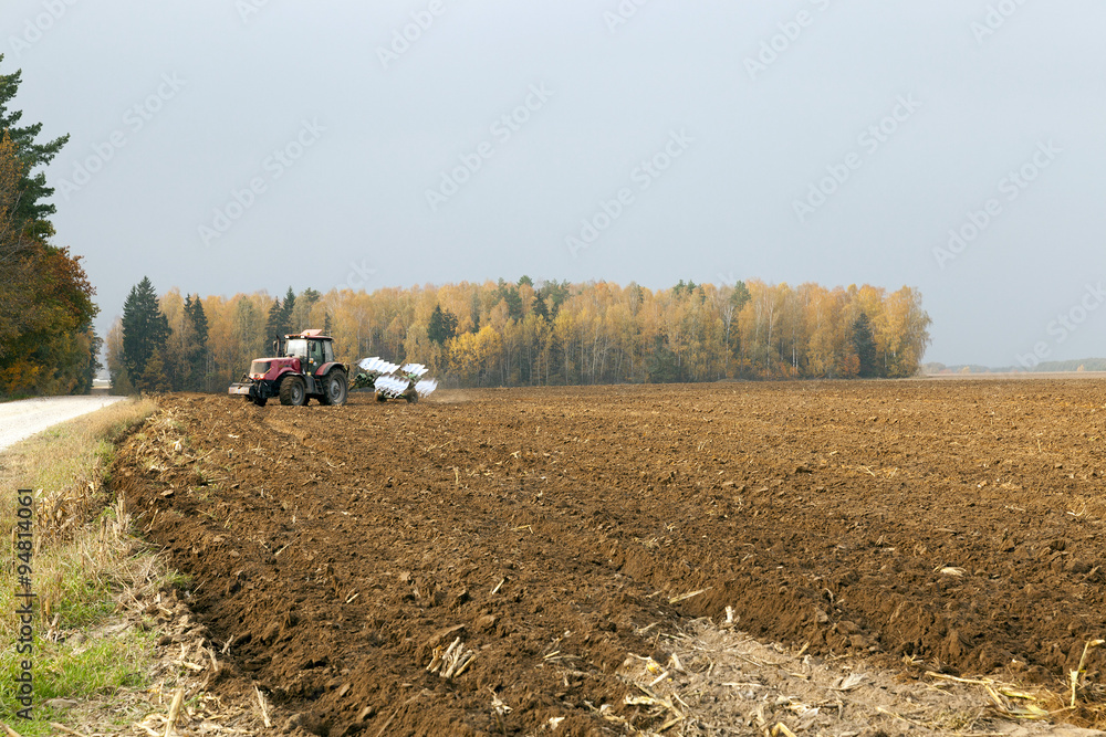 Fototapeta premium plowed field by a tractor 