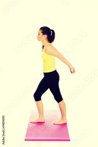 Fitness woman doing stretching exercise.