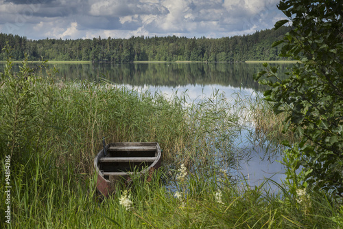 boat at shoreline in Lake in Karula Rahvuspark photo