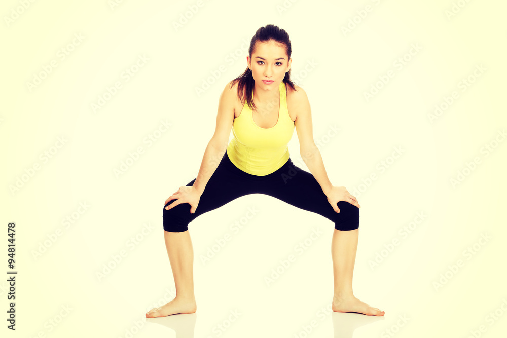 Young woman in warm up exercise.