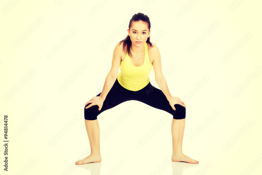 Young woman in warm up exercise. Young woman in warm up exercise.